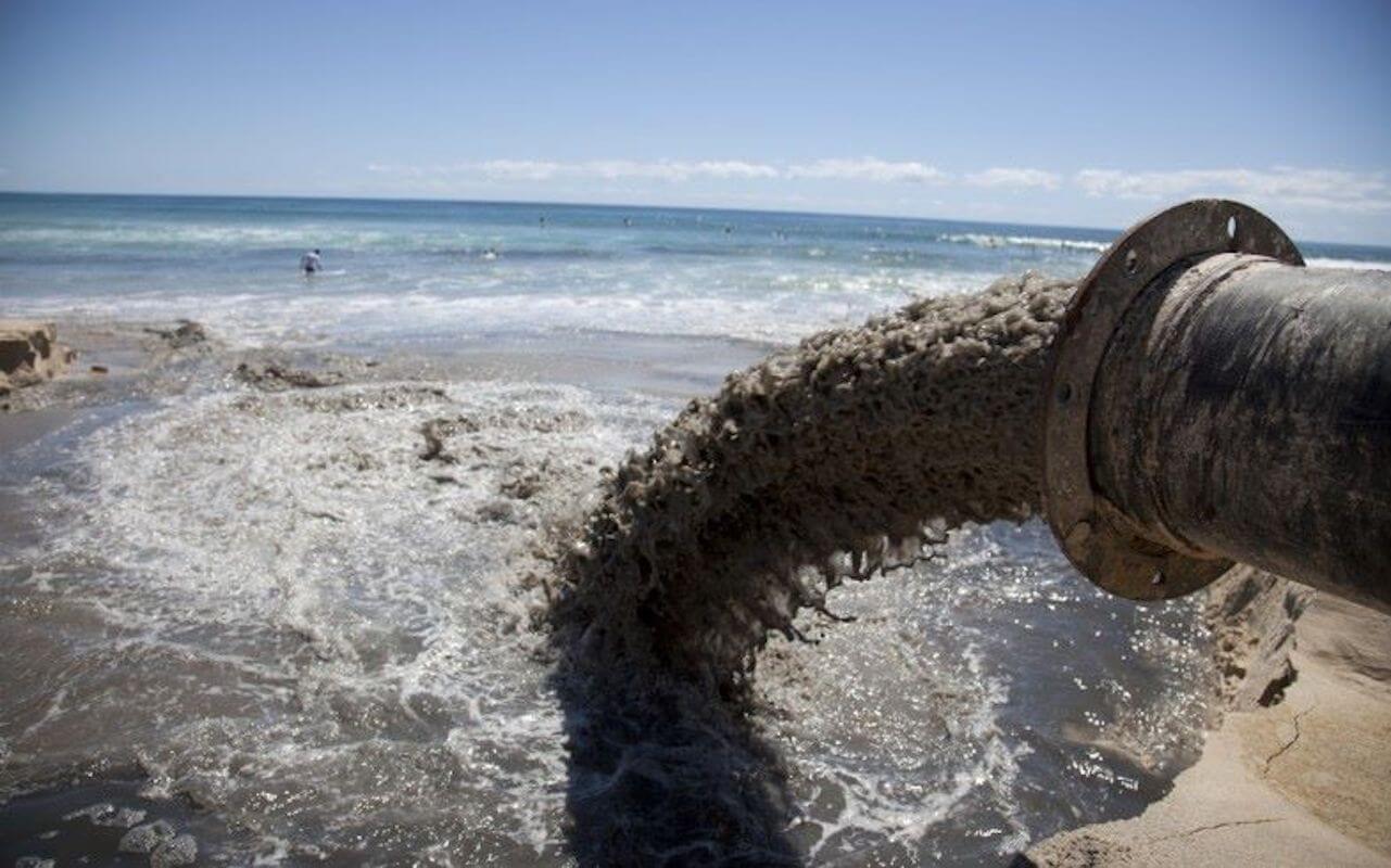 A chemical pipe pours into the ocean, fast fashion is one of the worst water polluters