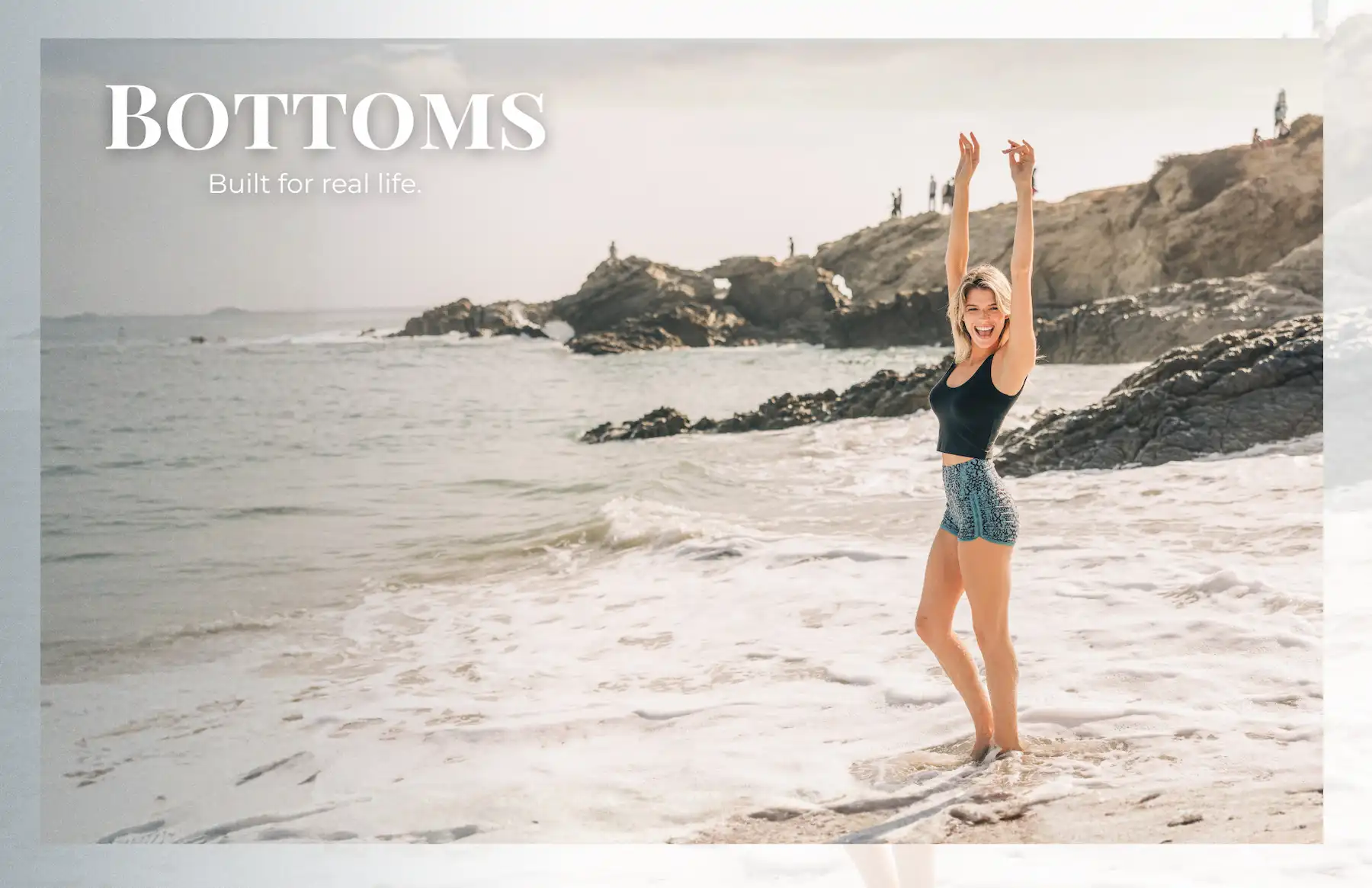 Young woman playing in the ocean wearing bottoms built for real life.